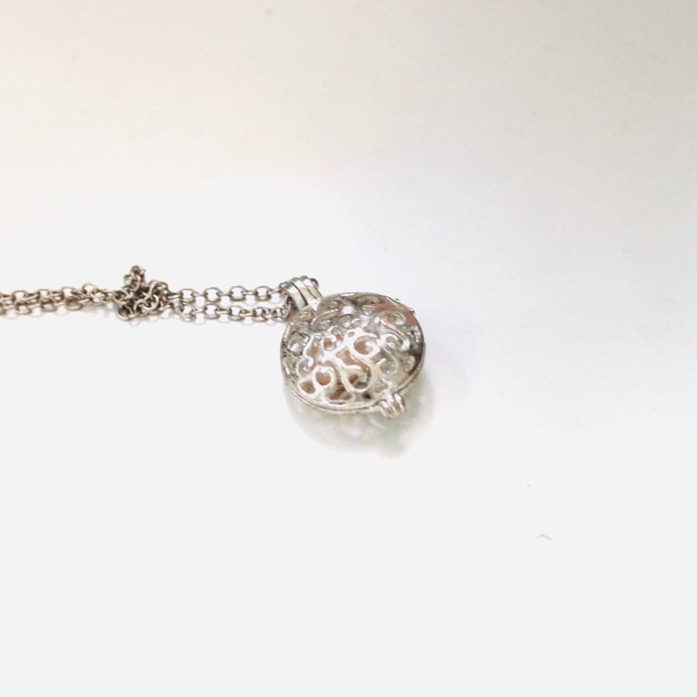 Silver caged pearl necklace